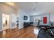Recreation room with hardwood floors, ceiling fan, and ample lighting and bathroom access at 4859 Augusta Ave, Oldsmar, FL 34677