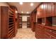 Spacious walk-in closet with custom shelving and drawers, offering ample storage space at 4859 Augusta Ave, Oldsmar, FL 34677