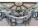 Stylish bar area with ample seating and a large screen, ideal for casual gatherings and events at 5014 Coastal Oak Ct, Lakewood Ranch, FL 34211
