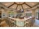 Upscale bar boasts a large U-shaped countertop, multiple TVs, and an array of seating for patrons at 5014 Coastal Oak Ct, Lakewood Ranch, FL 34211
