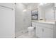 Clean bathroom with a large shower, toilet, and a white single sink vanity at 5014 Coastal Oak Ct, Lakewood Ranch, FL 34211