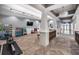 Bright exercise area equipped with weights and TV, with easy access to the outside at 5014 Coastal Oak Ct, Lakewood Ranch, FL 34211