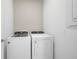 Functional laundry room with modern washer and dryer units at 5014 Coastal Oak Ct, Lakewood Ranch, FL 34211