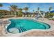 Charming community pool includes accessibility features, tiered steps, and pristine, inviting turquoise water at 5014 Coastal Oak Ct, Lakewood Ranch, FL 34211