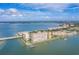 Gorgeous aerial view of waterfront complex with bridge access, marina and tropical landscaping at 5200 Brittany Dr. S # 706, St Petersburg, FL 33715