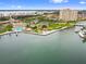 Breathtaking aerial view of the building complex along the water with lush landscaping and boat docks at 5200 Brittany Dr. S # 706, St Petersburg, FL 33715