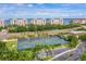 Aerial shot featuring tennis courts, beautiful landscaping, and lovely waterfront residences, showcasing the community at 5200 Brittany Dr. S # 706, St Petersburg, FL 33715
