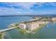 Panoramic aerial view of waterfront condo buildings with beautiful bay views and clear blue skies at 5200 Brittany Dr. S # 706, St Petersburg, FL 33715