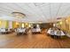 Beautiful banquet room with elegant decor, set tables, and stunning chandelier lighting at 5200 Brittany Dr. S # 706, St Petersburg, FL 33715