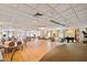 Large banquet room with wood floors, elegant lighting and set tables for formal dining at 5200 Brittany Dr. S # 706, St Petersburg, FL 33715