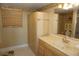 Spacious bathroom with ample storage, marble counter, and decorative tile floor at 5200 Brittany Dr. S # 706, St Petersburg, FL 33715