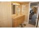 Comfortable bathroom with marble counters, ample storage, and decorative shelving at 5200 Brittany Dr. S # 706, St Petersburg, FL 33715