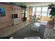 Beautiful living room with water views, neutral color, and elegant furniture at 5200 Brittany Dr. S # 706, St Petersburg, FL 33715