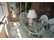 Cozy living room featuring matching sofa, two lamps, table, and glass coffee table at 5200 Brittany Dr. S # 706, St Petersburg, FL 33715