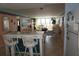 Open-concept living area with a breakfast bar and a view of the dining area and water at 5200 Brittany Dr. S # 706, St Petersburg, FL 33715