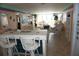 Bright living room featuring tiled breakfast bar, and comfortable seating overlooking a bright vista at 5200 Brittany Dr. S # 706, St Petersburg, FL 33715