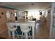 Bright living room featuring tiled breakfast bar, and comfortable seating and large windows at 5200 Brittany Dr. S # 706, St Petersburg, FL 33715