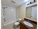 Bright bathroom with white tile, granite countertop, and shower-tub combination at 5221 Bayshore Blvd # 29, Tampa, FL 33611