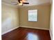 Bright bedroom with hardwood floors, ceiling fan, and a window with blinds at 5221 Bayshore Blvd # 29, Tampa, FL 33611
