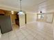 Open-concept living space with neutral tile flooring, ceiling fan, and lots of natural light at 5221 Bayshore Blvd # 29, Tampa, FL 33611