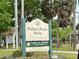 Ballast Point Park sign surrounded by trees and lush greenery in a recreational area at 5221 Bayshore Blvd # 29, Tampa, FL 33611