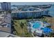 Aerial view of a condo complex featuring a large, heart-shaped pool and lush landscaping at 5277 Isla Key S Blvd # 422, St Petersburg, FL 33715