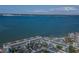 Stunning aerial view of a condo complex overlooking a bay with blue water and skyline in the background at 5277 Isla Key S Blvd # 422, St Petersburg, FL 33715