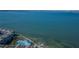 Scenic aerial view of waterfront condos with a pool and clear waters, combining leisure and coastal living at 5277 Isla Key S Blvd # 422, St Petersburg, FL 33715