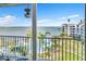 Balcony view of a community pool, the water and palm trees, creating a relaxing outdoor experience at 5277 Isla Key S Blvd # 422, St Petersburg, FL 33715