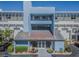 Exterior shot of a building with blue facade and a unique architectural design at the entrance at 5277 Isla Key S Blvd # 422, St Petersburg, FL 33715