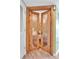 Unique wooden doors featuring glass inserts that lead into a sitting room at 5277 Isla Key S Blvd # 422, St Petersburg, FL 33715