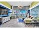Bright living room with water views, fireplace, large windows, and coastal-inspired decor at 5277 Isla Key S Blvd # 422, St Petersburg, FL 33715