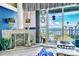 Living room featuring fireplace, balcony access, and beautiful views of the water at 5277 Isla Key S Blvd # 422, St Petersburg, FL 33715