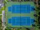 Aerial shot of tennis courts surrounded by greenery and offering recreational opportunities at 5277 Isla Key S Blvd # 422, St Petersburg, FL 33715