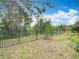 Backyard with privacy fence and view of the surrounding landscape at 6328 Desert Peace Ave, Land O Lakes, FL 34639