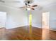 Large primary bedroom with hardwood floors and walk in closet access to ensuite bathroom at 6328 Desert Peace Ave, Land O Lakes, FL 34639