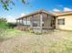 View of screened in lanai overlooking backyard at 6328 Desert Peace Ave, Land O Lakes, FL 34639
