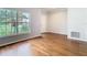 Bright living room showcasing hardwood floors, natural light, and neutral paint for a clean, modern feel at 6328 Desert Peace Ave, Land O Lakes, FL 34639