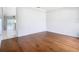 Bright living room boasts gleaming hardwood floors, fresh paint, and opens to other living areas at 6328 Desert Peace Ave, Land O Lakes, FL 34639