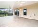 Covered screened in porch with ceiling fans, overlooking the private backyard at 6328 Desert Peace Ave, Land O Lakes, FL 34639