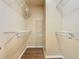 Walk-in closet featuring multiple tiers of wire shelving for optimal storage solutions at 6328 Desert Peace Ave, Land O Lakes, FL 34639