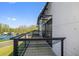 Exterior shot of building with multiple balconies, each with a metal railing at 6500 Motor Enclave Way # 513, Tampa, FL 33610