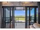 View of outdoor balcony with seating and scenic green space seen through sliding glass doors at 6500 Motor Enclave Way # 513, Tampa, FL 33610