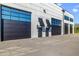 Modern building exterior with large garage doors and stylish unit number 512 at 6500 Motor Enclave Way # 513, Tampa, FL 33610