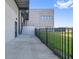 Modern building exterior with a sleek design, a fence, and a well-maintained grassy area at 6500 Motor Enclave Way # 513, Tampa, FL 33610