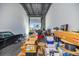 Bright garage interior filled with boxes, tools, and a classic car, demonstrating ample storage potential at 6500 Motor Enclave Way # 513, Tampa, FL 33610
