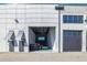 Spacious garage interior with an open entrance, concrete walls, high ceilings, and a car inside at 6500 Motor Enclave Way # 513, Tampa, FL 33610