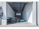 Expansive garage space with an open layout, high ceilings, and a green car visible inside at 6500 Motor Enclave Way # 513, Tampa, FL 33610