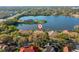 A beautiful aerial view showcases the home with the lake in the background at 7226 Bryce N Pt, Pinellas Park, FL 33782
