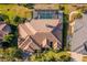 Aerial top-down view of a home highlighting the roof, pool, and landscaping at 7226 Bryce N Pt, Pinellas Park, FL 33782